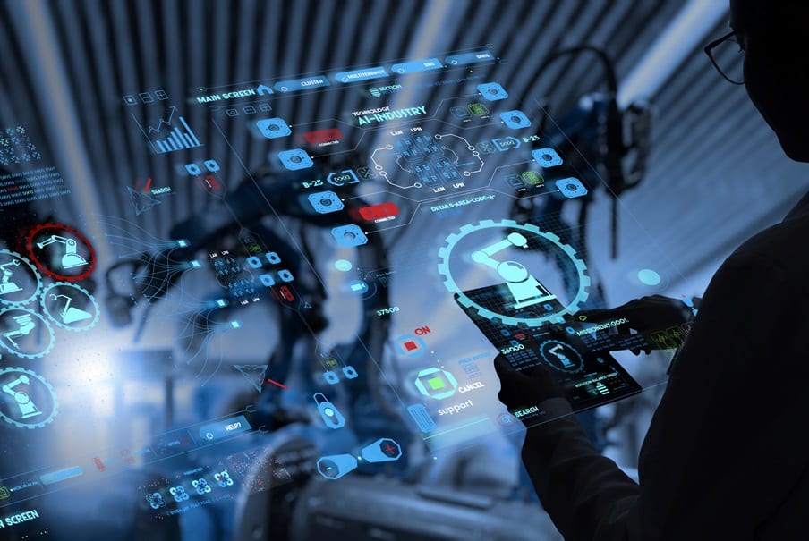 Factory Female Industrial Engineer working with automation robot arms machine in intelligent factory industrial on real time monitoring system software.Digital future manufacture.