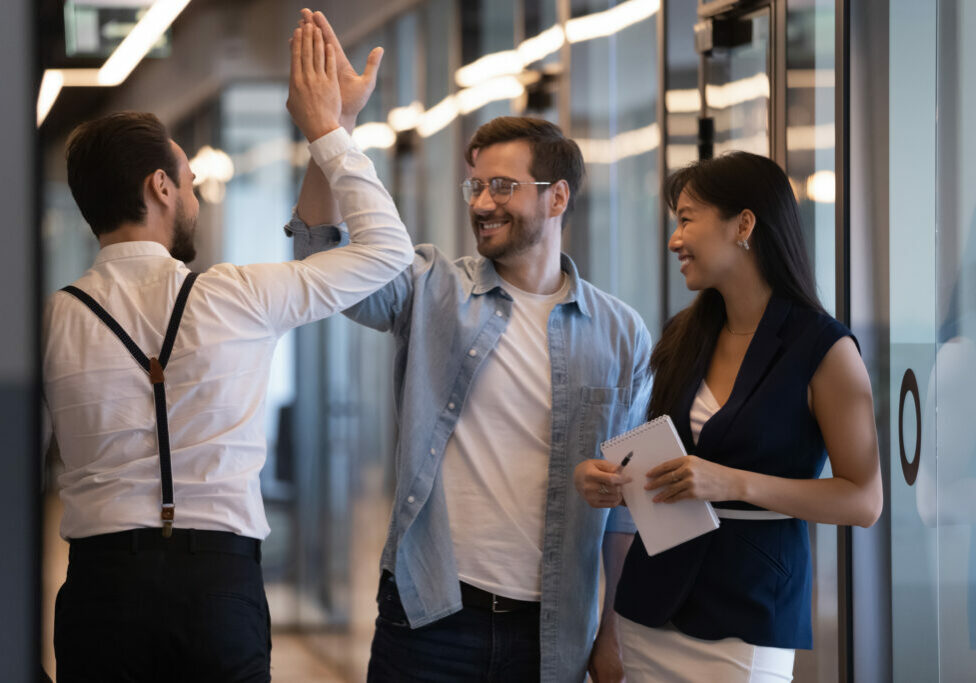 Friendly,Male,Colleagues,Giving,High,Five,Talking,Standing,In,Office Friendly,Male,Colleagues,Giving,High,Five,Talking,Standing,In,Office
